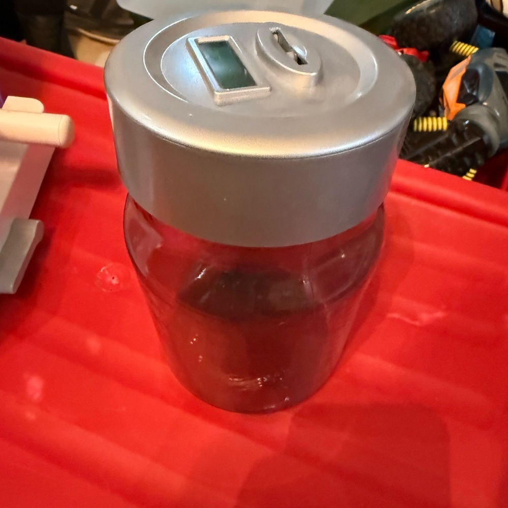 Silver and Clear Coin Bank Jar